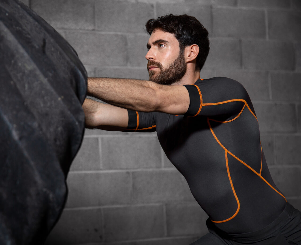 Exosuit-EXO1-top-man-flipping-tyre-carousel-size